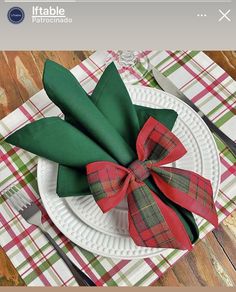 a white plate topped with green and red napkins