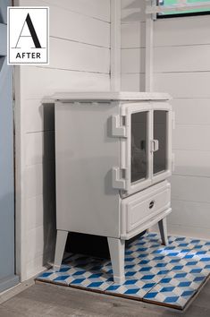 a white stove sitting on top of a blue and white checkerboard tile floor