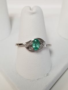 "Thanks for shopping our vintage estate store. We tend to sell well below wholesale and truly hope you enjoy all of our items. Many of the items are one of a kind, so please enjoy scrolling through the pictures and hopefully something will catch your eye. Brown spots are from the camera. Estate ring nice sterling silver 925 natural .25ct emerald with 2 small diamonds. Custom made ring, meaning we set the gem into the setting. Ring size: please select a size Setting: 3/8\" 8mm Band width: 1.5mm W Oval Hallmarked May Birthstone Ring, Oval May Birthstone Ring Hallmarked, Oval May Birthstone Ring, Hallmarked Oval Ring For May Birthstone, Oval Emerald Ring Stamped 925 Fine Jewelry, Oval Emerald Ring Stamped 925, Fine Jewelry Oval Emerald Ring, Oval Sterling Silver Rings For May Birthstone, Oval Rings With Diamond Accents For May Birthstone