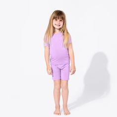 Introducing our Lavender Bamboo Kids Pajama Short Set, where comfort meets style in the most delightful way! Crafted from the softest bamboo fabric, these pajamas are gentle on the skin and perfect for a restful night's sleep. With a charming lavender hue and a snug fit, your little one will drift off to dreamland feeling cozy and cute. Shop now and make bedtime a breeze! Perfect Fit: Designed to accommodate all body types with a touch of stretch and a wonderfully smooth fabric. Super Soft Waist Baby Skin, Bamboo Fabric, Kids Pajamas, Pajama Shorts, Short Pajama Set, Oversized Tee, Snug Fit, Short Sets, Sensitive Skin