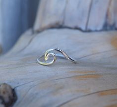 This minimalist sterling silver ocean wave ring is completely handmade by Desiree Rose Jewelry. It is simple enough to wear on its own or with other rings. For anyone who loves the ocean, having this ring on your finger is the perfect way to keep a piece of the ocean with you at all times.  Please note, this wave is left facing. If you would like to have it facing the other direction please send me a message and I would be happy to make the change for you! **This ring is also available in Gold Filled. If you prefer gold over silver, please choose this option when adding the ring to your basket.  ----------- Sizing: ----------- This ring was made with high quality round sterling silver or gold filled wire. It currently comes in sizes 5, 5.5, 6, 6.5, 7, 7.5, 8, 8.5, 9, 9.5 & 10. If you need Wave Rings, Rings With Meaning, Minimalist Silver Ring, Wave Beach, Ocean Inspired Jewelry, Jewelry Minimalist, Wave Ring, Ocean Inspired, Rose Jewelry