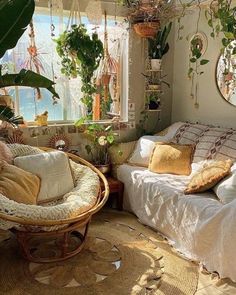 a bed room with a neatly made bed and hanging plants