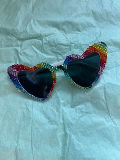 Rainbow heart sunglasses. Bulk orders are subject to discount and/or free shipping. Cute Summer Sunglasses With Glass Material, Fun Sunglasses With Gradient Lenses For Parties, Cool Party Sunglasses With Polarized Lenses, Cool Polarized Sunglasses For Party, Multicolor Sunglasses For Summer Parties, Playful Gradient Lens Sunglasses For Party, Cool Sunglasses With Mirrored Lenses For Party, Playful Sunglasses With Gradient Lenses For Party, Cute Glass Sunglasses For Summer