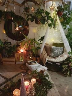 a living room filled with lots of plants and candles