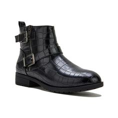 a pair of black boots with buckles on the side and an alligator skin pattern