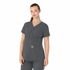 This maternity scrub top simplifies your life so your focus stays sharp and your comfort stays strong while you're expecting. It's designed with all the features you need for practical wear at work, like two oversized top-loading front pockets that take care of larger essentials and daily must-haves. Slip your phone into a smaller mesh pocket built right in, so you always know where it is and have easy access when you need to check in. A scissor pocket on your right keeps that must-have tool in Maternity Scrub Top, Maternity Scrubs, Carhartt Womens, Must Have Tools, Oversized Top, Scrub Tops, Check In, Summer Essentials, Empire Waist