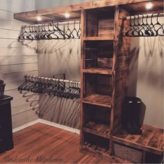 a wooden shelf filled with shoes next to a wall mounted coat rack and shoe rack