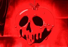 a red apple with a skull hanging from it's side