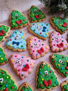 decorated cookies are arranged in the shape of christmas trees