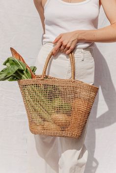 Palm Leaf Bucket Bag For Market, Natural Straw Bag Fair Trade, Eco-friendly Palm Leaf Bag With Open Weave, Natural Straw Fair Trade Bag, Eco-friendly Natural Straw Bag, Eco-friendly Fair Trade Natural Beach Bag, Palm Leaf Tote Beach Bag For Market, Palm Leaf Bag For Beach Season Market, Eco-friendly Straw Beach Bag Fair Trade