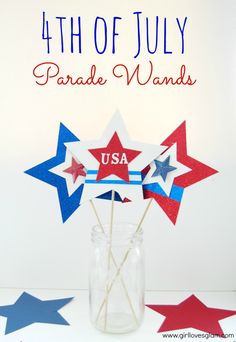 the fourth of july parade wands are in a vase