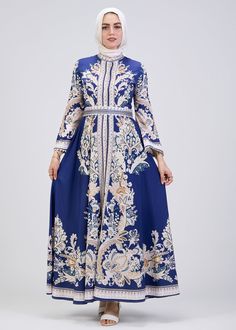 Step into timeless elegance with our Royal Blue Floral Print Satin Modest Dress, designed to elevate your wardrobe for every season. This modest dress features a luxurious satin fabric that drapes beautifully while offering comfort and sophistication. The intricate floral pattern in soft hues enhances the royal blue background, creating a striking yet graceful look. With its high neck and long kimono sleeves, this modest dress exudes a sense of classic charm. The empire waistline, accentuated wi Blue Long Dress For Eid, Elegant Floral Print Maxi Dress For Eid, Silk Long Sleeve Dress For Eid, Elegant Blue Maxi Dress For Eid, Blue Fitted Maxi Dress For Eid, Fitted Blue Maxi Dress For Eid, Blue Floral Print Dress For Banquet, Blue Silk Long Sleeve Maxi Dress, Elegant Floral Print Dress For Eid