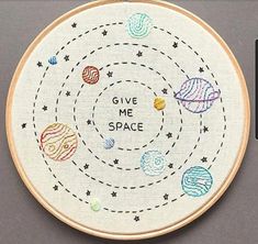 a cross stitch pattern with the words give me space on it and nine planets in different colors