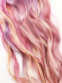 pink and yellow hair on white background