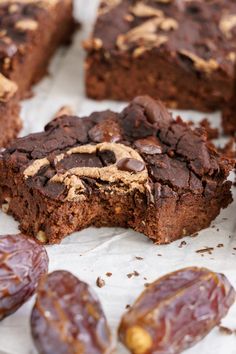 chocolate brownies with peanut butter on top and dates around the edges, ready to be eaten