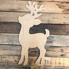 a wooden cutout of a deer with antlers on it's head