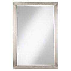 a white framed mirror on a wall