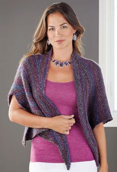 a woman wearing a purple top and cardigan