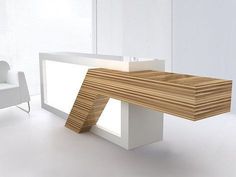 a wooden table sitting next to a white chair