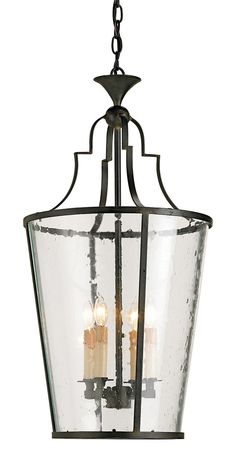 a light fixture with three candles hanging from it