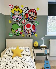 a bed room with a neatly made bed next to a guitar and wall decals