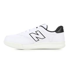 Ensure your young athlete stays comfortable and supported with the Boys' New Balance 300 Wide Sneakers. Designed with wider sizing to accommodate growing feet, these sneakers offer the perfect blend of style and functionality for active boys. Classic round toe, Lace-up closure for a secure fit, Cushioned footbed, Padded collar and fabric lining for added comfort, Textured outsole provides traction | Boys' New Balance 300 Wide Sneakers in White/Black Size 6 - Big Kid Sneakers With Branded Insole For Light Sports, Casual Slip-resistant Basketball Shoes For Light Sports, Sporty White New Balance Skate Shoes, New Balance Lace-up Skate Shoes, White Slip-resistant Basketball Shoes For Sports, White Sole Slip-resistant Skate Shoes For Sports, White Slip-resistant Basketball Shoes, New Balance Sporty Sneakers For Sports, Sporty New Balance Sneakers For Sports