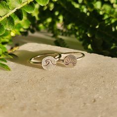 Cute and dainty stacker rings with either a wave or sunrise/ sunset design. These rings are hand shaped, stamped, and made of .925 sterling silver. Dress them up or down, they would make the perfect addition to any outfit. Perfectly paired with my wave stacker ring design or worn solo for a minimalist look. Each ring comes wrapped in its own box and ready to give as a gift. Each would make an excellent stocking stuffer for the outdoorsy, beach lover in your life.  Listing is for one ring. Please choose design at checkout. The wave signet ring is a size 7.5. The sunrise signet ring is a size 7. Minimalist Rings For Summer Gifts, Minimalist Midi Rings For Summer Gift, Minimalist Midi Rings As Summer Gift, Minimalist Stackable Wavy Rings, Gift Wavy Stackable Rings, Gift Stackable Wavy Rings, Sunrise Design, Sunset Design, Stacker Rings