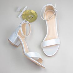 Our Leah is made for brides who are looking for comfortable wedding shoes! Made with the most comfortable low block heels, Leah is the perfect shoes for all day comfort! Also, these wedding shoes with block heels are perfect for outdoor and garden weddings where you won't be worried about heels getting stuck!!! Wedding Shoes Block Heel Style “Leah” in ivory 2 inch block heel Block heels Adjustable ankle strap with buckle closure for secure fit Sizing – This style runs true to size Padded insole Silver Bridesmaid Shoes, Comfortable Wedding Heels, Wedding Shoes Block Heel, Comfortable Wedding Shoes, Peep Toe Wedding Shoes, Glitter Wedding Shoes, Shoes For Bride, Gold Wedding Shoes, Wedding Shoes Low Heel