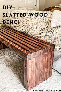 a wooden bench sitting on top of a carpeted floor