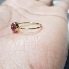 14k solid yellow gold natural oval shaped cabochon tourmaline semi precious gemstone ring. 1. The weight of the natural tourmaline gemstone used in the ring =0.65 cts. 2. The weight of the 14k solid yellow gold used in the ring =0.860 grms. The ring is very nice and beautiful. Thanks Yellow Gold Tourmaline Cabochon Ring, Fine Jewelry Stackable Oval Ruby Ring, Stackable Oval Ruby Ring In Fine Jewelry, Oval Ruby Ring Stackable For Formal Occasions, Fine Jewelry Solitaire Oval Cabochon, Oval Stackable Ruby Ring In Yellow Gold, Tourmaline Ring With Bezel Setting In Oval Cabochon, Tourmaline Bezel Set Ring In Oval Cabochon, Tourmaline Bezel-set Oval Cabochon Ring