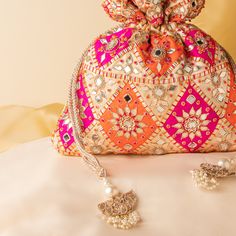 "Artisan Handcrafted Wedding Drawstring Pouch Purse | Gota Patti Mirror Work Indian Exclusive Potli Purse | Designer Evening Small Bag Woman Package Contents: 1 Size: 10\" x 8\" Designed with the heart, this beautiful Potli or batawa bag are eye catchy and made of premium material. Key Features: Embroidery art work.  This potli is good match with both Indian and western outfits and are superb for wedding and festive parties. This would be best complement to your designer saree, lenhga or any other kind of dress. This is the combination of traditional and modern embroidery work. This is enough to keep your accessories and all needed essentials and it can be a best gift for any woman." Multicolor Potli Bag For Wedding And Navratri, Festive Handmade Multicolor Pouch, Bollywood Style Multicolor Wedding Bags, Elegant Multicolor Potli Bag With Dori Work, Multicolor Handwork Pouch For Gift, Bollywood Style Multicolor Potli Bag For Wedding, Multicolor Clutch For Wedding Festivals, Multicolor Clutch For Wedding And Festivals, Multicolor Handwork Pouch For Celebration