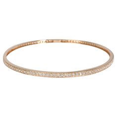 Diamond Bangle in 18k Rose Gold 1.75 CTW PRIMARY DETAILS SKU: 117284 Listing Title: Diamond Bangle in 18k Rose Gold 1.75 CTW Condition Description: Retails for 2995 USD. In excellent condition and recently polished. Chain is 8 inches in length. Metal Type: Rose Gold Metal Purity: 18k Chain or Bracelet Length (in): 8 Pre-Owned Jewelry Condition: Excellent SIDE STONE INFORMATION Side Stone 1 Gem Type: Diamond Side Stone Weight 1 (cts): 1.75 Side Stone 1 Shape: Round Brilliant Side Stone 1 Color: G Diamond Bangle In Rose Gold With Pave Setting, Rose Gold Diamond Bangle With Pave Setting, Rose Gold Bangle With Pave Setting, Rose Gold Diamond Bracelet With Pave Setting For Wedding, Rose Gold Pave Diamond Bracelet For Wedding, Classic Rose Gold Bangle With Single Cut Diamonds, Rose Gold Diamond Bangle With Single Cut Diamonds, Rose Gold Bracelet With Brilliant Cut For Wedding, Rose Gold Brilliant Cut Bangle For Weddings