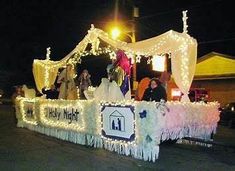 a float is decorated with lights and decorations