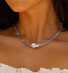 Blue Pearl Necklace With Charm For Beach, Blue Beaded Necklace With Pearl Charm For Beach, Blue Pearl Beach Jewelry, Blue Beaded Necklace With Pearl Charm, Blue Pearl Necklaces For Beach, Blue Pearl Necklaces For The Beach, Blue Single Strand Beaded Necklace For Summer, Bohemian Blue Pearl Necklace For Beach, Trendy Blue Beaded Necklaces For Summer