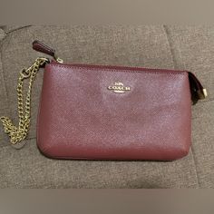 Never Used Coach Chain Wristlet. Has Card Slots On The Inside. Berry Burgundy Color Elegant Brown Wristlet For Evening, Elegant Brown Evening Wristlet, Coach Elegant Wristlet Gift, Elegant Coach Wristlet Perfect For Gifts, Elegant Coach Wristlet As Gift, Elegant Coach Wristlet For Gift, Elegant Gold Coach Wristlet, Elegant Red Wristlet With Zipper Pouch, Elegant Red Wristlet For Daily Use