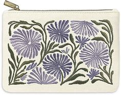 a white purse with purple flowers on it