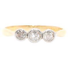 three stone diamond ring in yellow gold and white gold, circa 1950's or early 1960s's