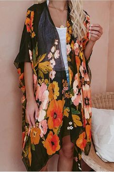 Step your look up a notch in our Shady Beach Floral Kimono! Printed with golden yellow, green, blush, orange, and mauve florals on a sheer black base. The open front design, side slits, and kimono sleeves add volume to the effortless layer. Keep your look simple with a basic tank and denim and let the kimono do the work for you! Relaxed Fit Open Front 100% Polyester Hand Wash Cold, Lay Flat to Dry Side Slit Lightweight Sheer One Size: Length measures 40” from shoulder to hem Beach Floral, Bath Dress, Floral Print Kimono, Print Kimonos, Split Dress, Floral Kimono, Kimono Sleeve, Ripped Denim, Golden Yellow