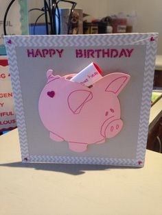 a happy birthday card with a pink pig holding a lipstick tube in it's mouth