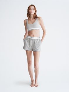 Our most iconic program, rooted in our past and reimagined for our future. These Calvin Klein modern cotton lounge sleep shorts are made from soft cotton and recycled polyester jersey for a partly sustainable design. Finished with a classic logo waistband, side pockets and seaming details.  Material: 58% Cotton, 39% Recycled Polyester, 3% Elastane. Sports Shorts Outfit, Calvin Klein Set, Calvin Klein Outfits, Outfit Codes, Sleep Shorts, Our Future, Sports Shorts, Logo Collection, Female Poses