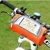 a bicycle handlebar with a map attached to the handle bar, in front of some green grass