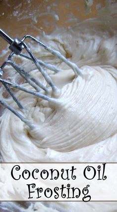 a bowl filled with whipped cream next to a whisk