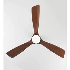 a ceiling fan with wooden blades and a white light in the center, on a white background