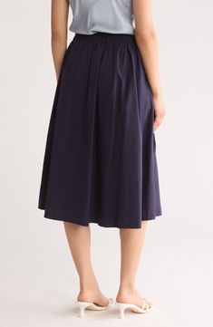 Every smart wardrobe needs this versatile midi skirt that takes you from desk to dinner with ease. 30" length (size Small) 76% rayon, 21% nylon, 3% spandex Machine wash, line dry Made in the USA Model stats: 5'10" height, 32" bust, 25" waist, 36" hip. Model is wearing size Small. Fitted Knee-length Pleated Skirt With Elastic Waistband, Summer Midi Skirt In Elastane, Rayon Midi Pleated Skirt, Summer Midi Elastane Skirt, Rayon Pleated Midi Skirt, Spring Elastane Pleated Skirt, Stretch Pleated Midi Skirt, Stretch Flared Pleated Skirt For Work, Rayon Pleated Flared Skirt