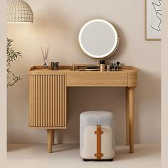 a dressing table with a mirror and stool next to it in a room that has a plant on the floor