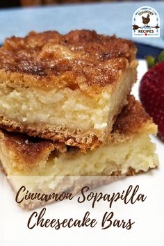 two pieces of cinnamon soappella cheesecake bars on a plate with strawberries