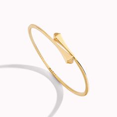 18 Karat Full Gold Slim Slip-On BraceletThis distinctive design features a solid gold bracelet crafted from 18K white, rose, or yellow gold. It can be worn alone or layered with other pieces of the collection for a fashion-forward look. Cleo by Marli draws inspiration from Cleopatra, evoking her strength and power capturing enriching color and daring design. Solid Gold Bracelet, Wrist Wrap, Hinged Bracelet, Fine Jewelry Bracelets, Rose Gold Bracelet, Yellow Gold Bracelet, Jewelry Bracelet, Bracelet Crafts, Ring Size Guide