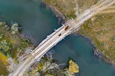 an aerial view of a bridge over a river