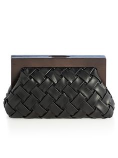 Carry your essentials in style with Shiraleah's Charlotte Frame Clutch. This handheld purse features a vegan leather woven texture and a wood top handle, adding a sophisticated edge to this chic silhouette. Measuring L 11" × W 4" × H 7.25", and equipped with a magnetic frame closure and inner slip pocket, the Charlotte Frame Clutch is the perfect addition to your favorite outfit. Pair with other items from Shiraleah to complete your look! Color: Black L 11" × W 4" × H 7.25" Woven Pu And Wood Mag Intrecciato Weave Clutch Pouch For Travel, Leather Clutch With Braided Handles For Daily Use, Chic Woven Leather Clutch For Everyday Use, Chic Everyday Woven Leather Clutch, Chic Black Woven Clutch, Chic Travel Clutch With Intrecciato Weave, Chic Intrecciato Weave Clutch For Travel, Chic Intrecciato Clutch For Travel, Chic Black Rectangular Coin Purse