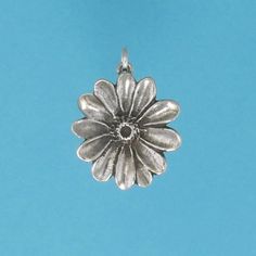 DESCRIPTION There is nothing like a field full of blooming Daisies. With their faces turned up to the sunshine, these bright flowers represent childhood, innocence and purity. Our shiny sterling silver Daisy charm makes a great gift for some one you love. Original design by Pat Frey 3/4 inch around Type: Three Dimensional Item Number: 1191 Flowers Represent, Childhood Innocence, Daisy Charm, Bright Flowers, Flower Charm, The Sunshine, Daisy Flower, Pendant Earrings, Three Dimensional